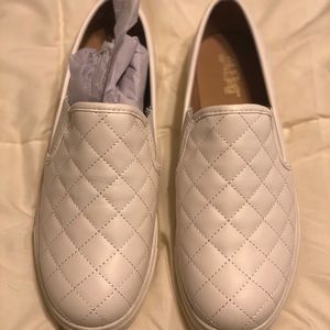 White flat slip on tennis sneaker